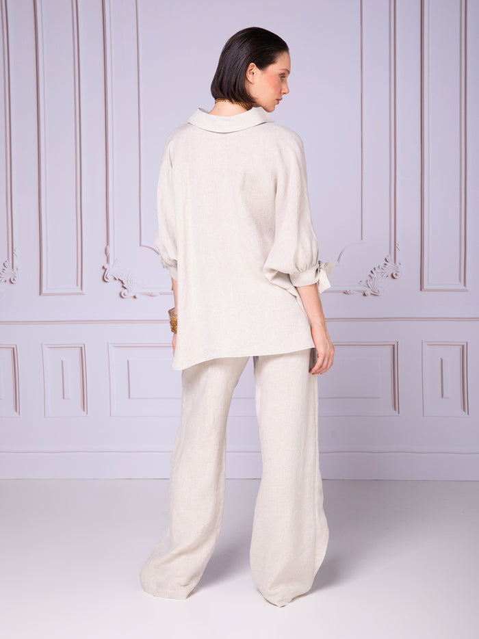 Blusa de manga amplia con puños plisados en lino